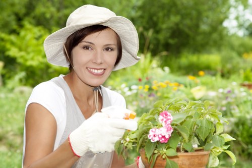 Gardener carrying out a booked garden maintenance service
