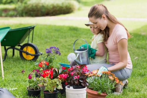 Professional gardeners shaping a tidy Stepney garden